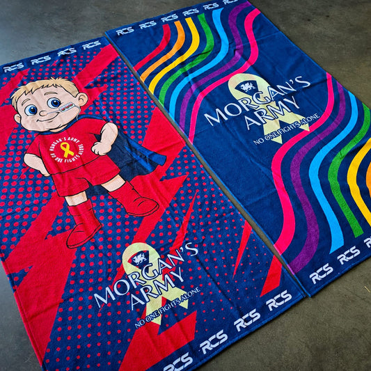 Two towels with 'Morgan's Army' branding on a concrete floor.